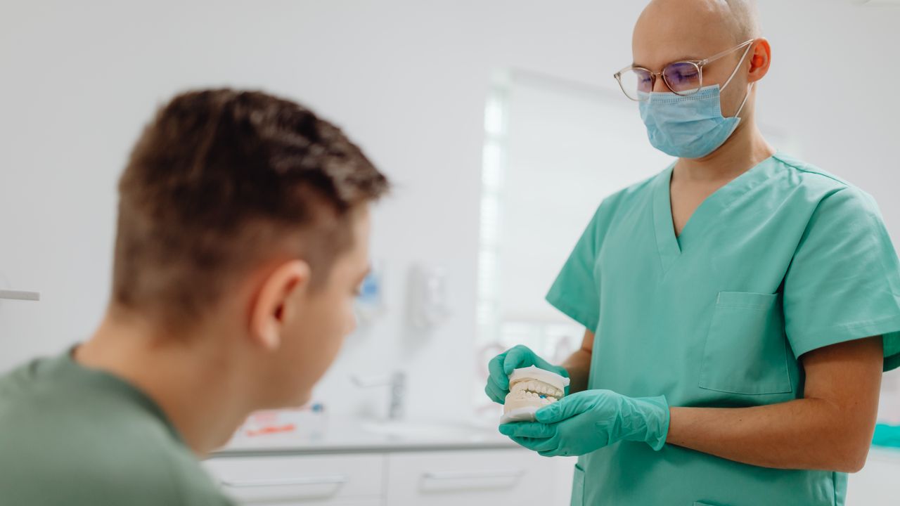 Smile makeover planning and shade matching at a dental office in Oakville