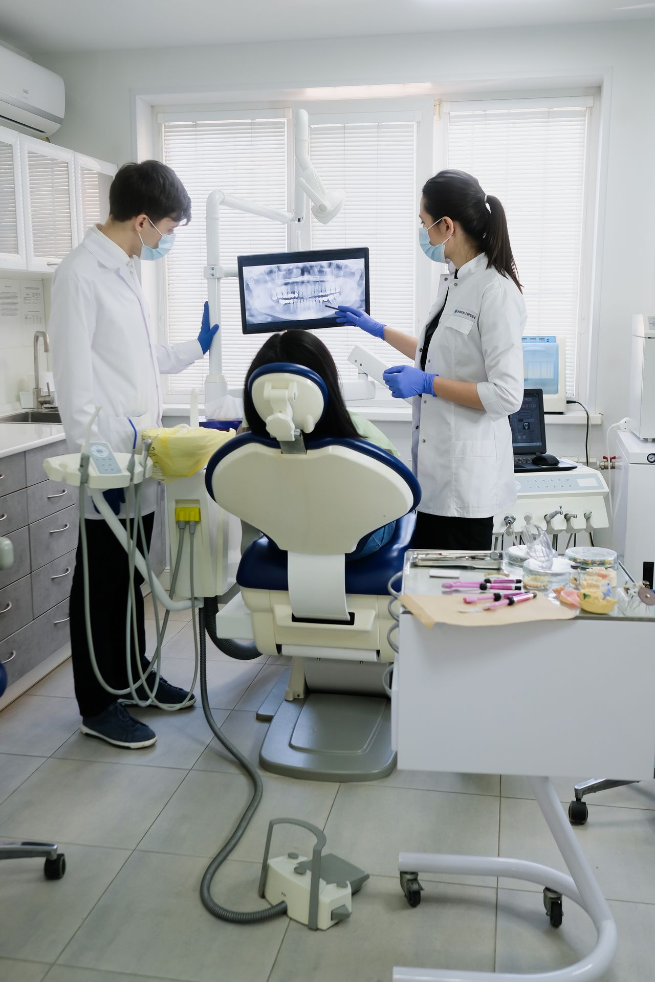 Dental team examining a patient for gum disease in Oakville
