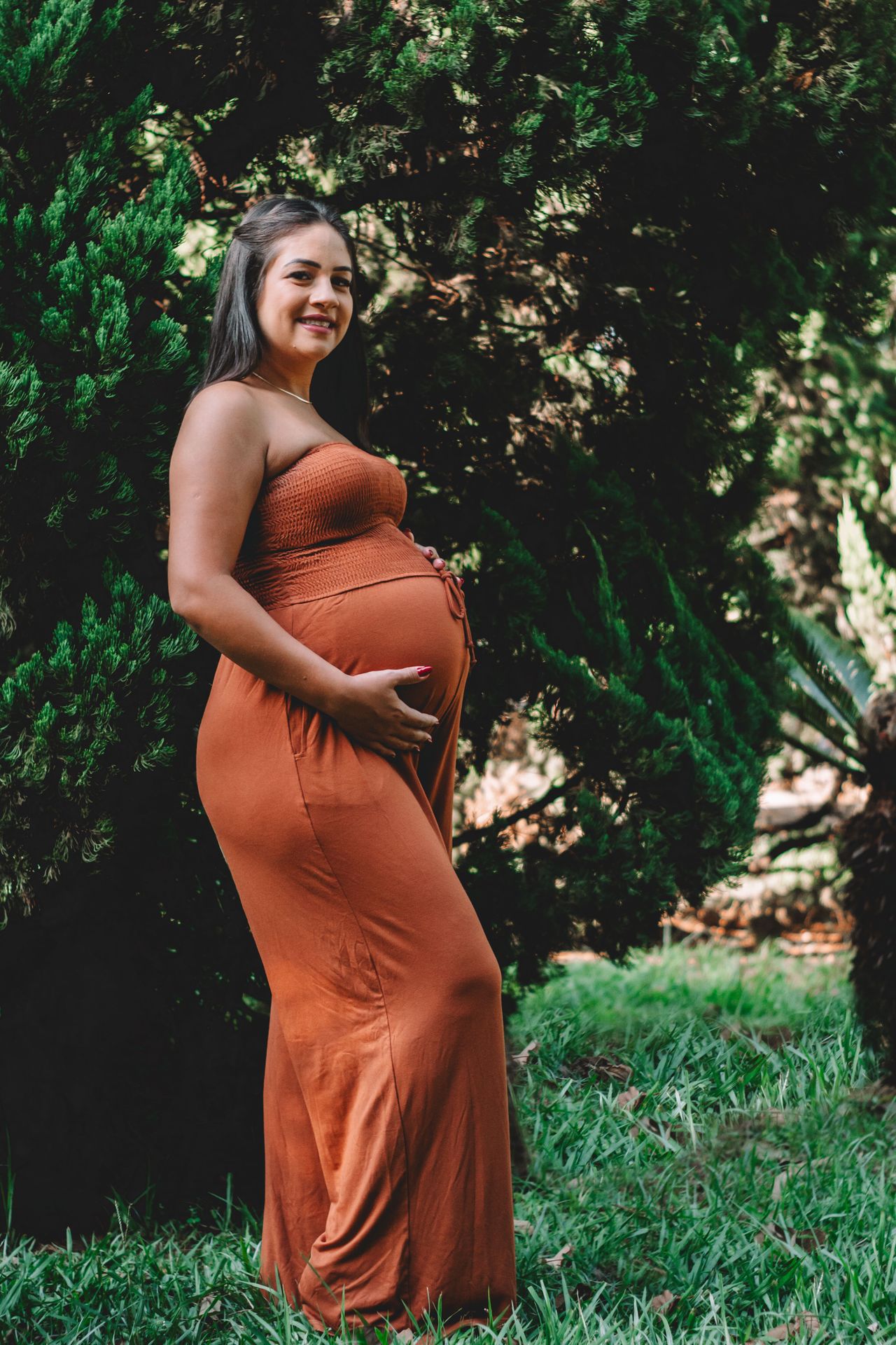 Smiling pregnant woman planning safe dental visits in Oakville