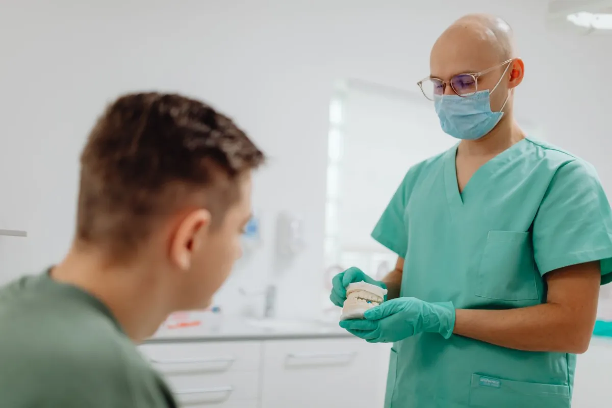 Dentist in Oakville explaining the dental implant procedure to a patient