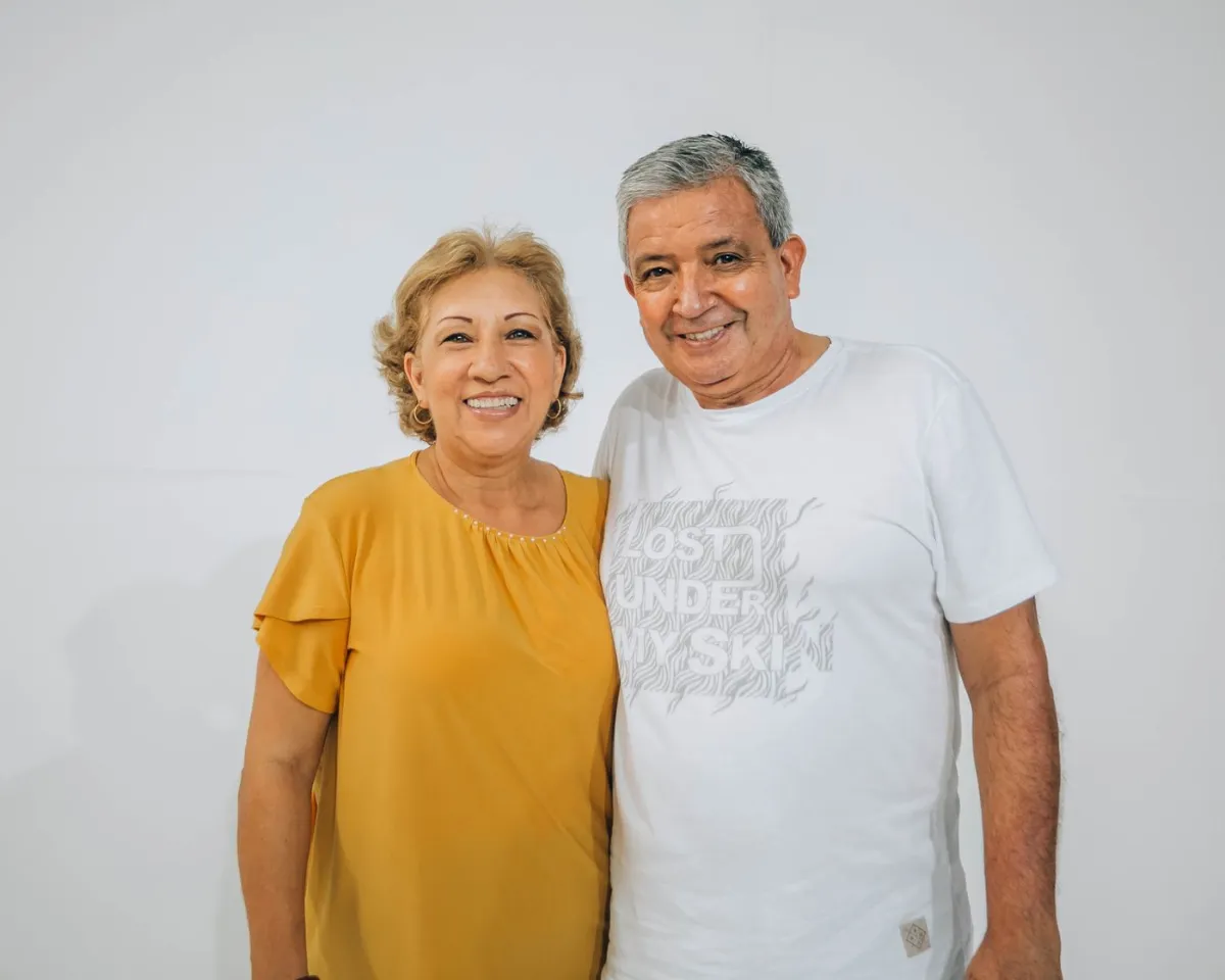 Senior couple smiling after dental implants in Oakville